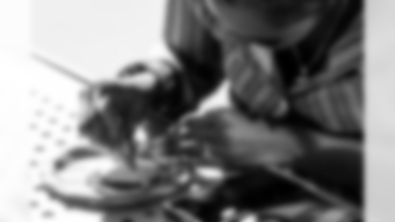 TAMPA, FL - December 05, 2025 - Mike and Ashli Evans host the Mike Evans Family Foundation 'Catch for Christmas' holiday event at AdventHealth Training Center. Photo By Kyle Zedaker/Tampa Bay Buccaneers