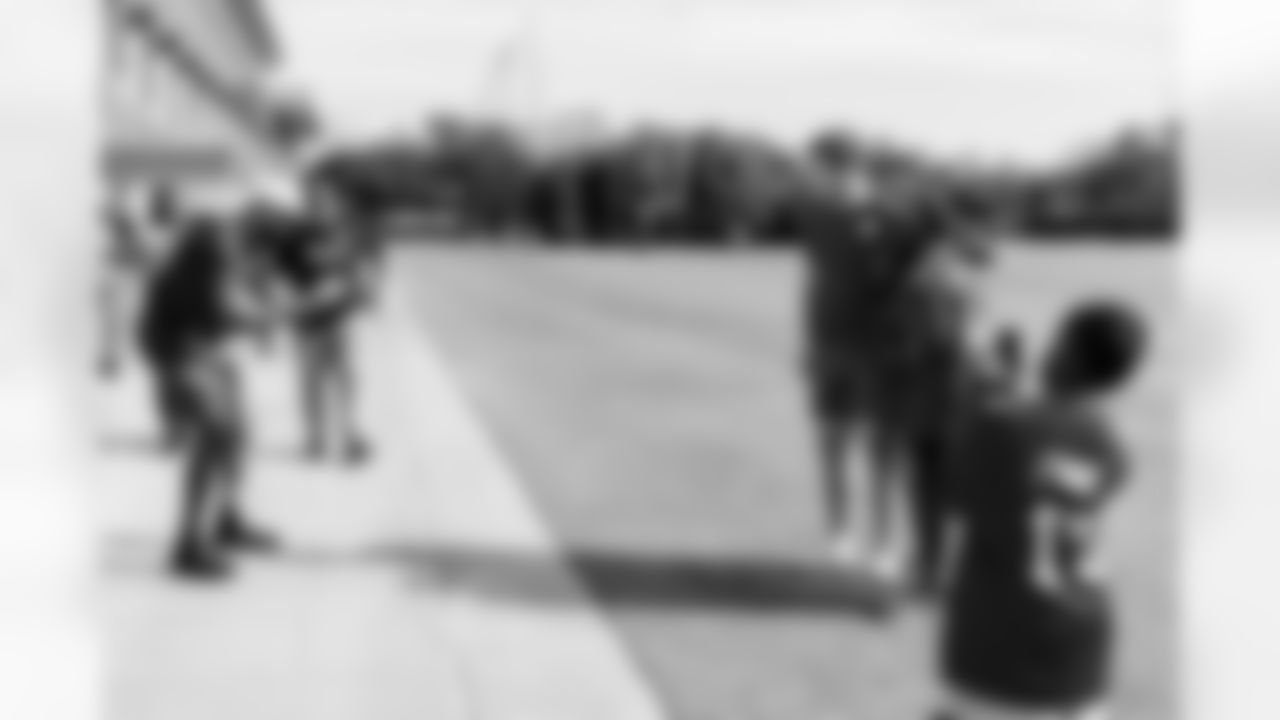 TAMPA, FL - December 05, 2025 - Mike and Ashli Evans host the Mike Evans Family Foundation 'Catch for Christmas' holiday event at AdventHealth Training Center. Photo By Kyle Zedaker/Tampa Bay Buccaneers