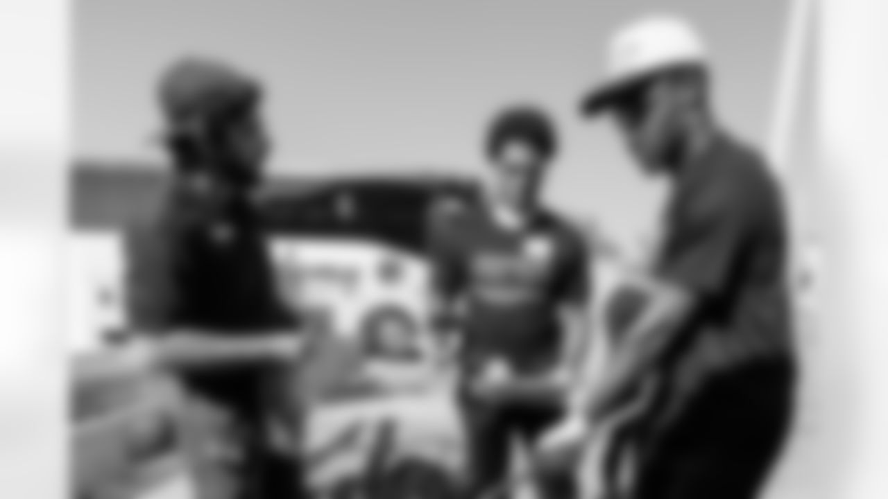 TAMPA, FL - November 18, 2025 - Cornerback Benjamin Morrison #21 and Cornerback Jacob Parrish #25 of the Tampa Bay Buccaneers during a home build with Habitat for Humanity of Tampa Bay Hillsborough. Photo By Doug DeFelice/Tampa Bay Buccaneers