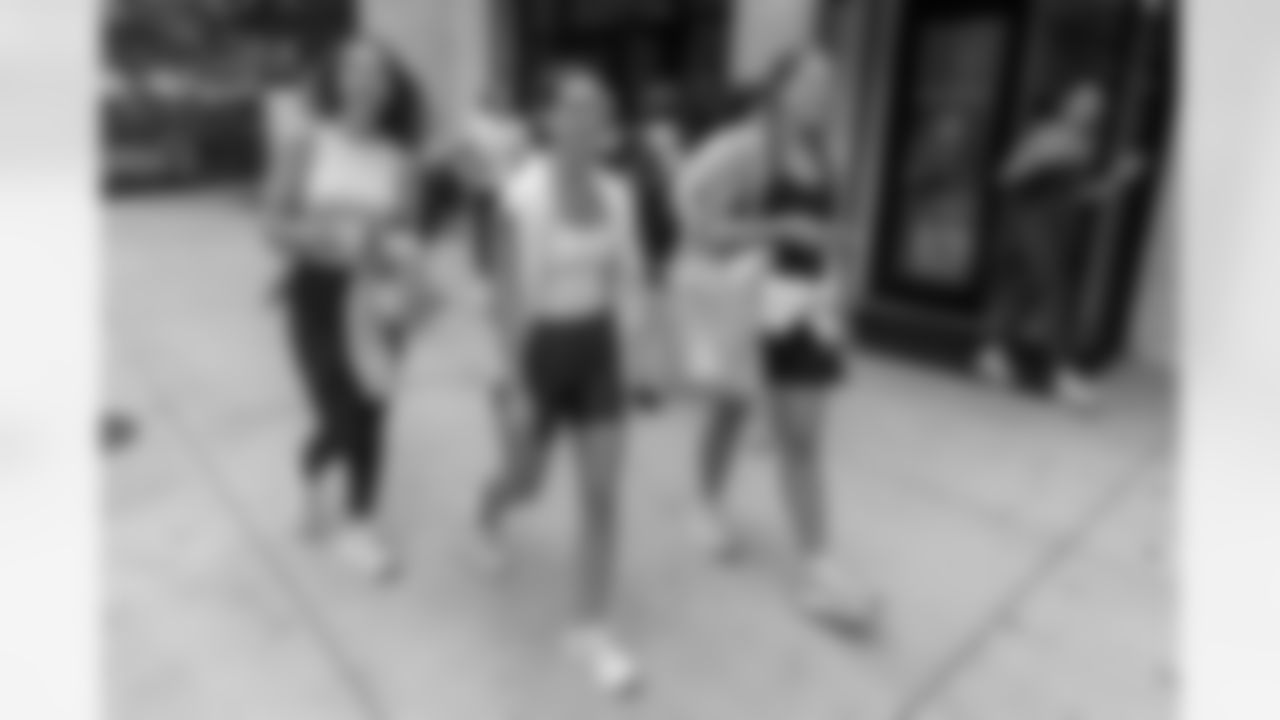 TAMPA, FL - December 06, 2025 - She is Football Bayshore Walk: Raise The Flags event with Bayshore Breakfast Club and Tampa Girls Social & Wellness at Hyde House Public Studio. Photo By Mike Carlson/Tampa Bay Buccaneers