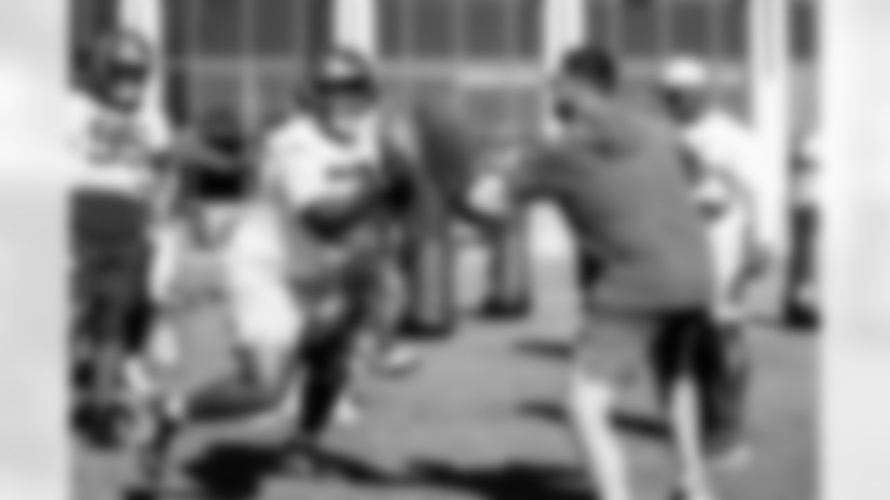 TAMPA, FL - November 20, 2025 - Defensive Lineman C.J. Brewer #52 and Defensive Quality Control Coach Joey Fitzgerald of the Tampa Bay Buccaneers during practice at AdventHealth Training Center. Photo By Tori Richman/Tampa Bay Buccaneers