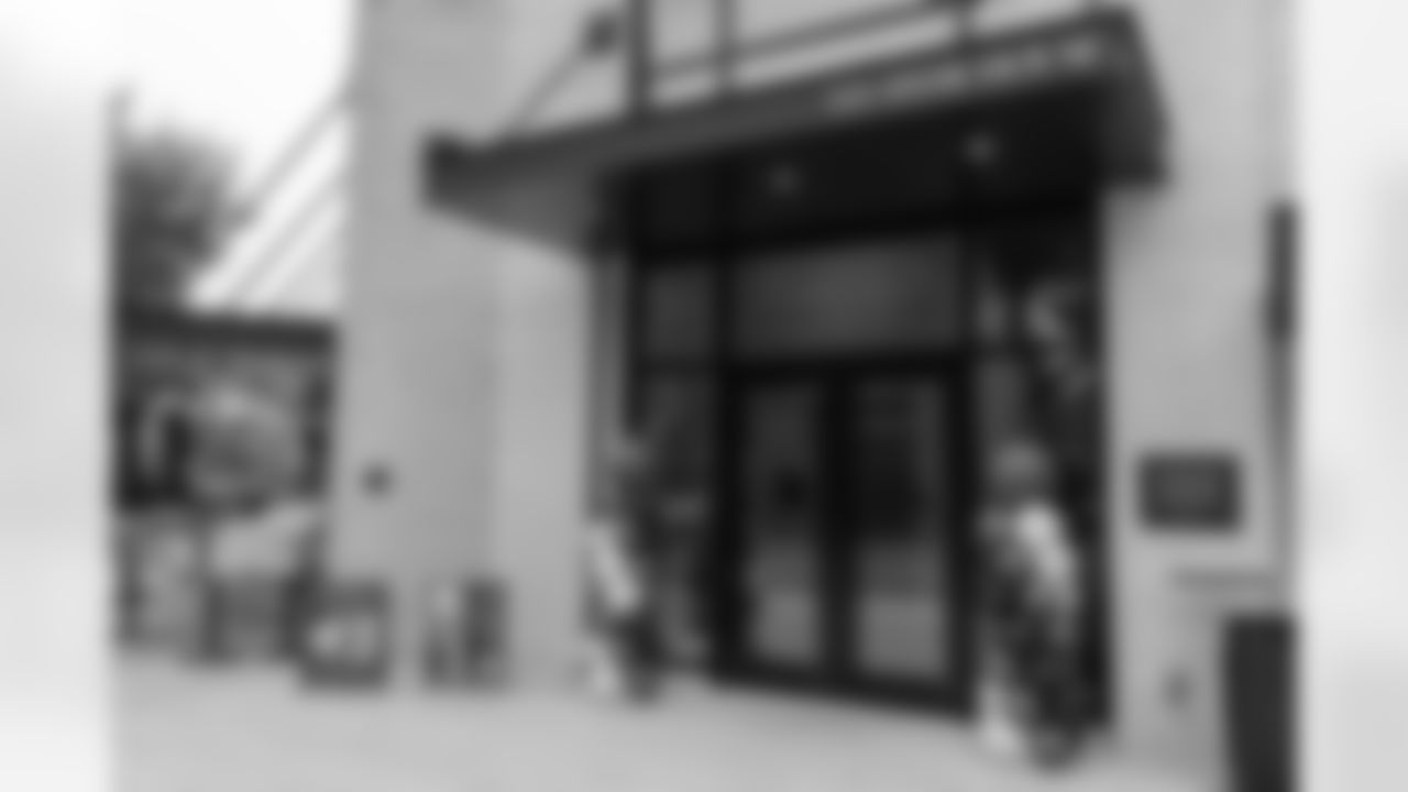 TAMPA, FL - December 06, 2025 - Set up for the She is Football Bayshore Walk: Raise The Flags event with Bayshore Breakfast Club and Tampa Girls Social & Wellness at Hyde House Public Studio. Photo By Mike Carlson/Tampa Bay Buccaneers