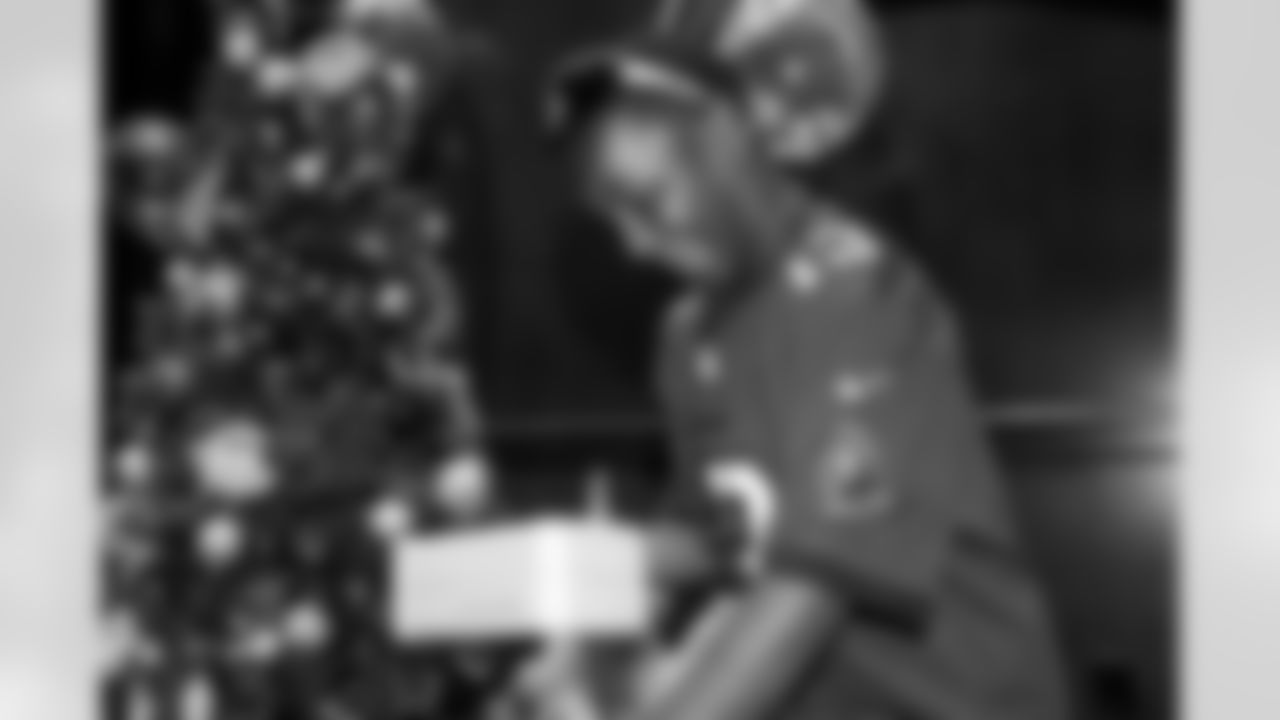 TAMPA, FL - December 05, 2025 - Mike and Ashli Evans host the Mike Evans Family Foundation 'Catch for Christmas' holiday event at AdventHealth Training Center. Photo By Kyle Zedaker/Tampa Bay Buccaneers