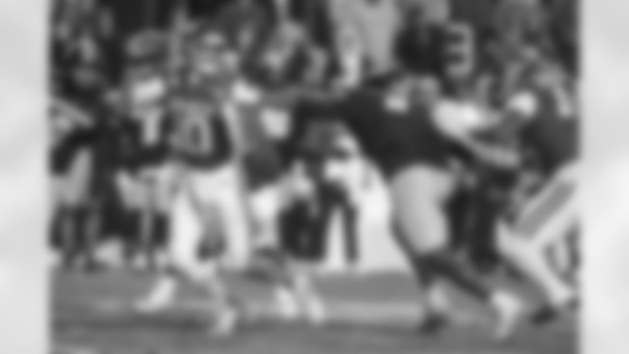 Arkansas quarterback Taylen Green (10) tries to get away from Missouri defensive end Zion Young (9) during an NCAA college football game Saturday, Nov. 29, 2025, in Fayetteville, Ark. (AP Photo/Michael Woods)