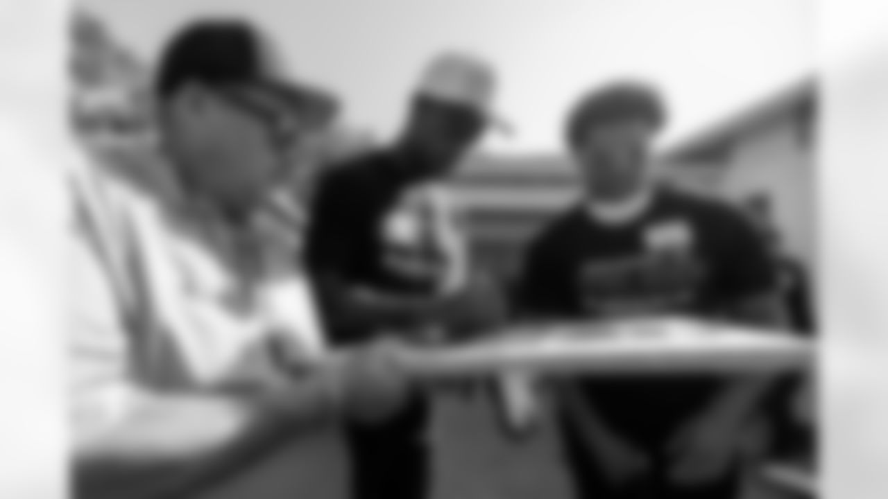 TAMPA, FL - November 18, 2025 - Cornerback Benjamin Morrison #21 and Cornerback Jacob Parrish #25 of the Tampa Bay Buccaneers during a home build with Habitat for Humanity of Tampa Bay Hillsborough. Photo By Doug DeFelice/Tampa Bay Buccaneers