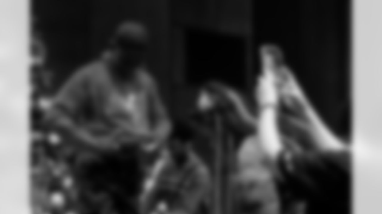 TAMPA, FL - December 05, 2025 - Mike and Ashli Evans host the Mike Evans Family Foundation 'Catch for Christmas' holiday event at AdventHealth Training Center. Photo By Kyle Zedaker/Tampa Bay Buccaneers