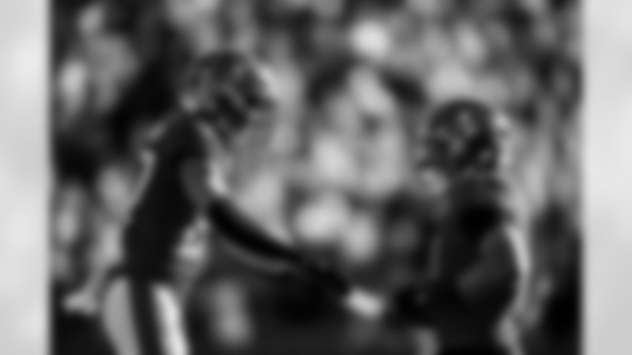 TAMPA, FL - November 30, 2025 - Cornerback Zyon McCollum #27 and Inside Linebacker SirVocea Dennis #8 of the Tampa Bay Buccaneers celebrate a turnover on downs during the game between the Arizona Cardinals and Tampa Bay Buccaneers. The Bucs won the game, 20-17. Photo By Kyle Zedaker/Tampa Bay Buccaneers