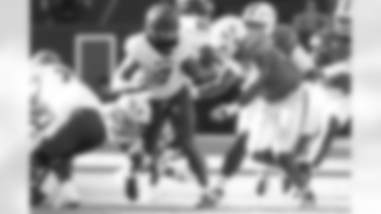 North Carolina State tight end Justin Joly (7) runs as Miami defensive lineman Armondo Blount (18) defends during the first half of an NCAA college football game, Saturday, Nov. 15, 2025, in Miami Gardens, Fla. (AP Photo/Lynne Sladky)