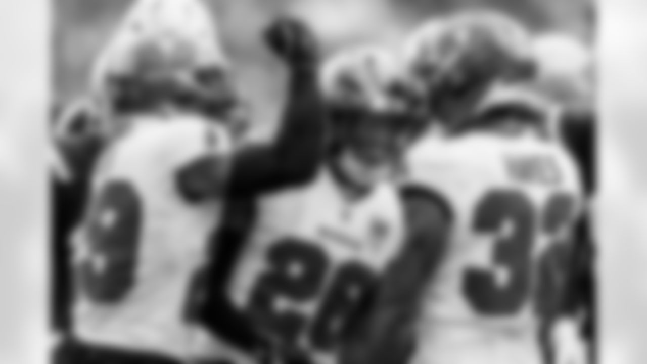 TAMPA, FL - November 09, 2025 - Safety Christian Izien #29, Safety Kaevon Merriweather #26, and Defensive Back Josh Hayes #32 of the Tampa Bay Buccaneers during the game between the New England Patriots and Tampa Bay Buccaneers. The Bucs lost the game, 28-23. Photo By Kyle Zedaker/Tampa Bay Buccaneers