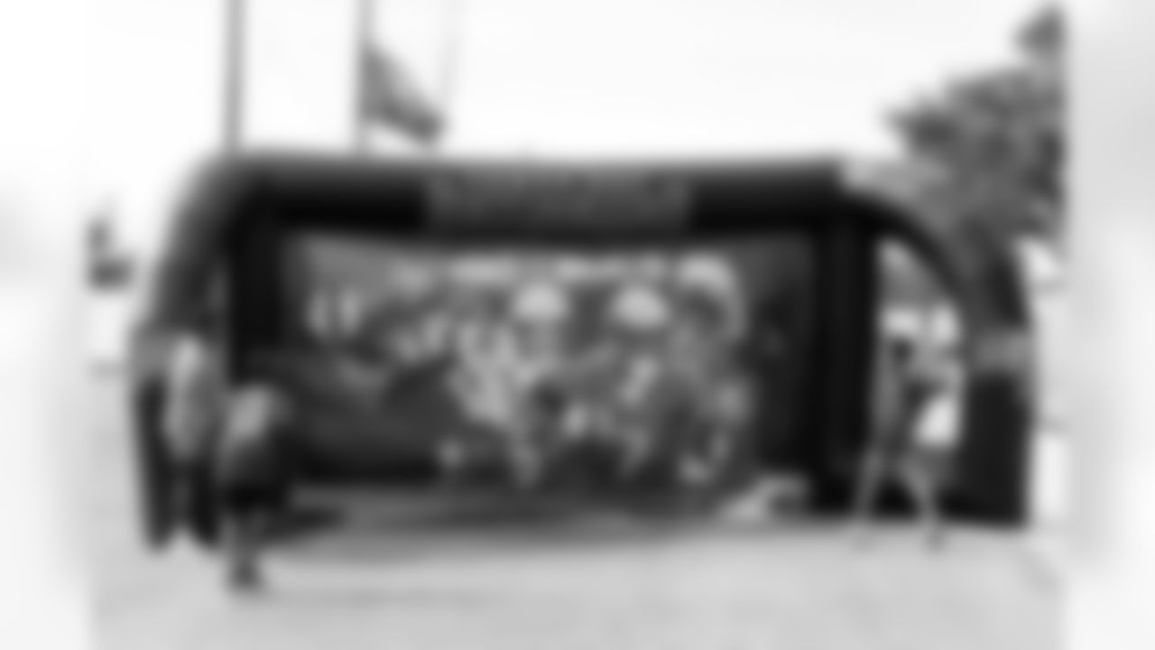 TAMPA, FL - December 05, 2025 - Mike and Ashli Evans host the Mike Evans Family Foundation 'Catch for Christmas' holiday event at AdventHealth Training Center. Photo By Kyle Zedaker/Tampa Bay Buccaneers