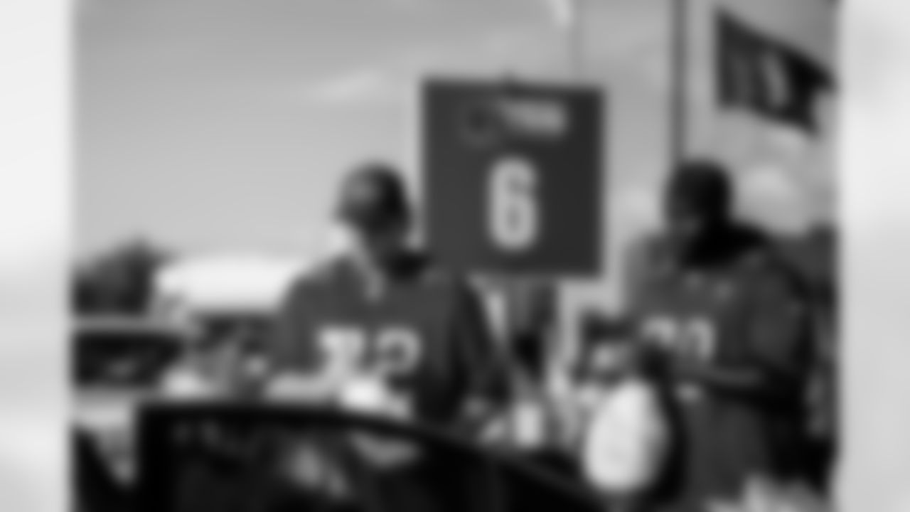 TAMPA, FL - November 25, 2025 - Guard Luke Haggard #72 and Offensive Tackle Benjamin Chukwuma #70 of the Tampa Bay Buccaneers during Turkey Time with the O-Line. Photo By Kyle Zedaker/Tampa Bay Buccaneers