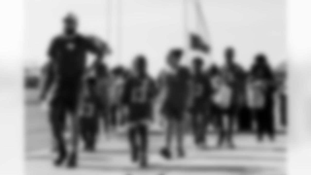 TAMPA, FL - December 05, 2025 - Mike and Ashli Evans host the Mike Evans Family Foundation 'Catch for Christmas' holiday event at AdventHealth Training Center. Photo By Kyle Zedaker/Tampa Bay Buccaneers