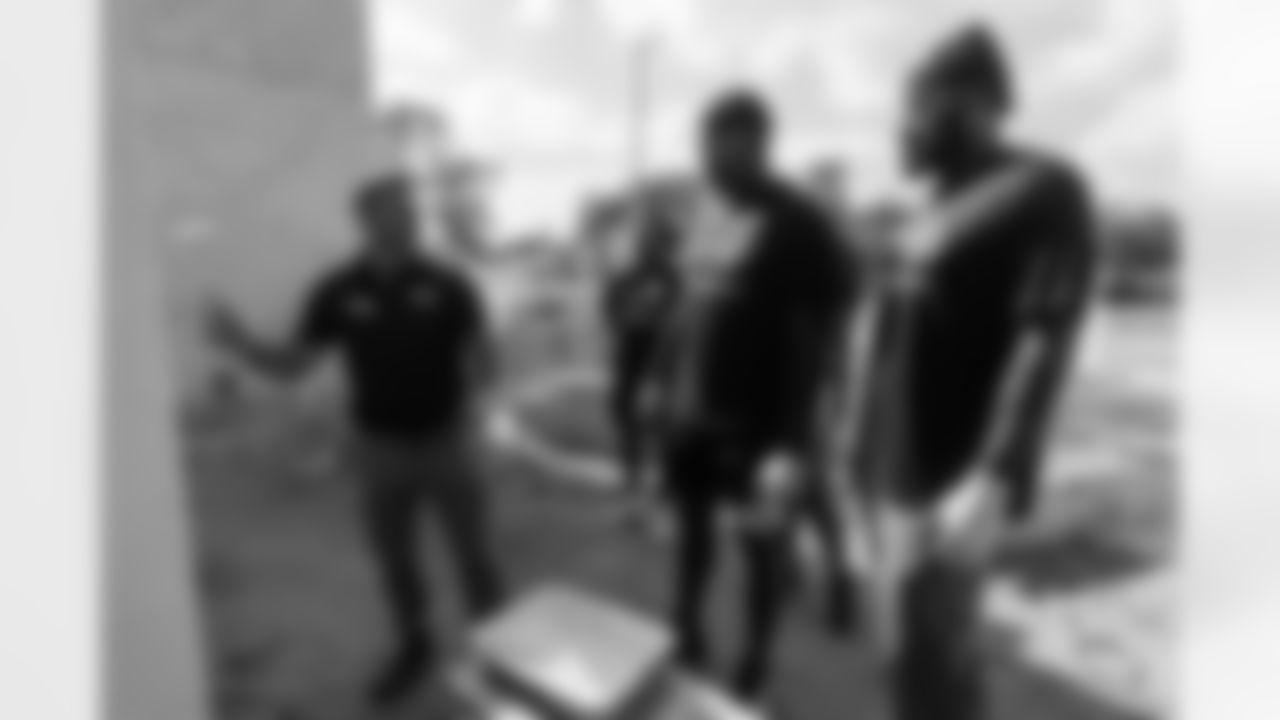 TAMPA, FL - November 18, 2025 - Outside Linebacker Yaya Diaby #0 and Tight End Devin Culp #82 of the Tampa Bay Buccaneers during a home build with Habitat for Humanity of Tampa Bay Hillsborough. Photo By Doug DeFelice/Tampa Bay Buccaneers