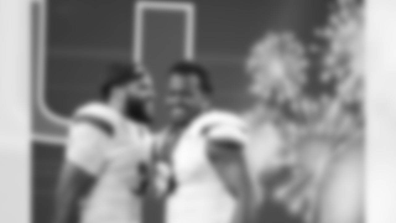 Miami defensive lineman Akheem Mesidor, left, and defensive lineman Rueben Bain Jr. react following the Cotton Bowl College Football Playoff quarterfinal game against Ohio State Wednesday, Dec. 31, 2025, in Arlington, Texas. (AP Photo/Julio Cortez)