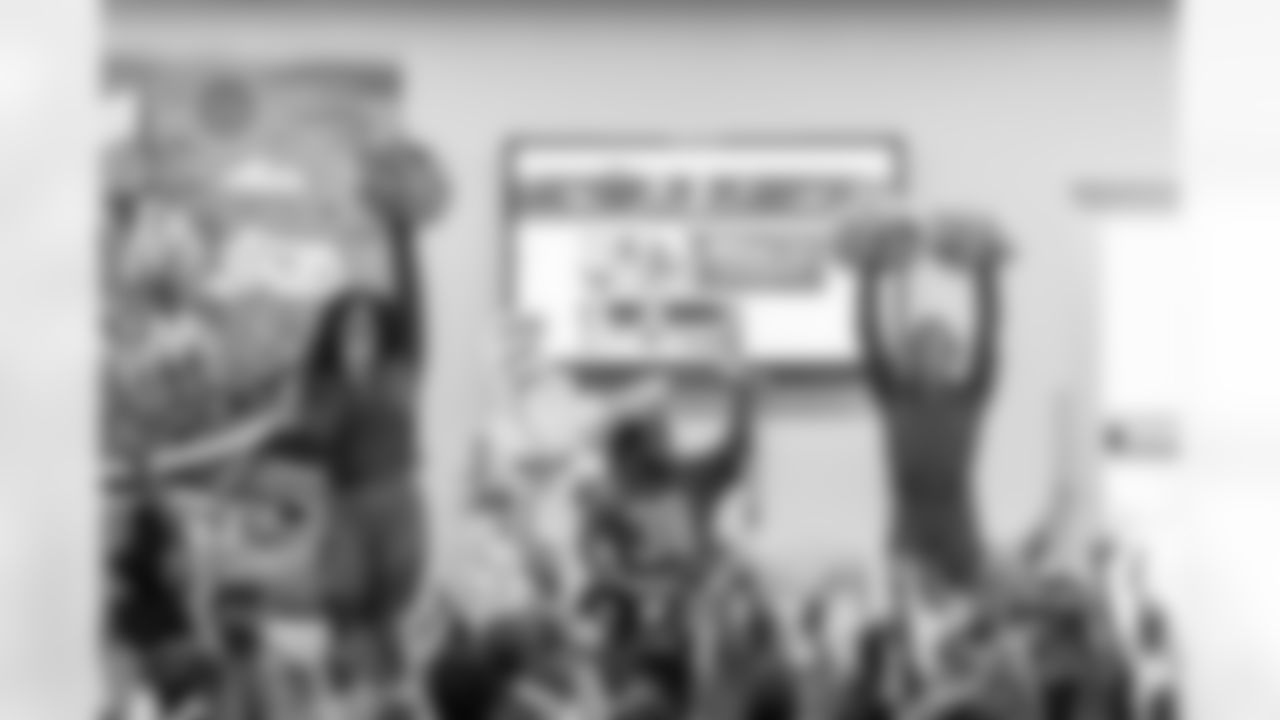 TAMPA, FL - March 03, 2026 - Safety Rashad Wisdom #38 of the Tampa Bay Buccaneers and Tampa Bay Buccaneers Cheerleaders during the National Reading Month celebration hosted by The Tampa Bay Buccaneers and Dr. Seuss Enterprises at Potter Elementary School. Photo By Doug DeFelice/Tampa Bay Buccaneers