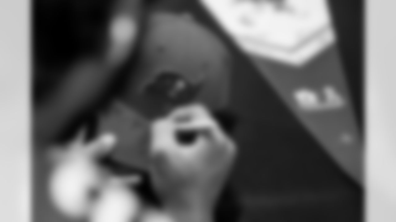 TAMPA, FL - December 02, 2025 - Autographs during a visit to MacDill Air Force Base. Photo By Kyle Zedaker/Tampa Bay Buccaneers