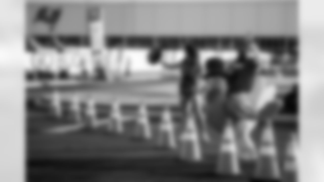 TAMPA, FL - November 25, 2025 - Volunteers during Turkey Time with the O-Line. Photo By Kyle Zedaker/Tampa Bay Buccaneers