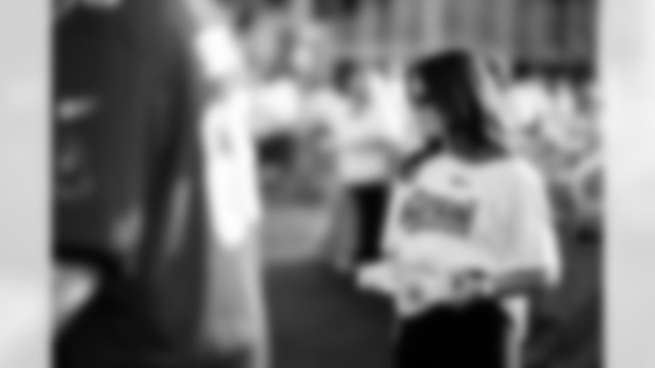 TAMPA, FL - November 25, 2025 - Volunteers during Turkey Time with the O-Line. Photo By Kyle Zedaker/Tampa Bay Buccaneers