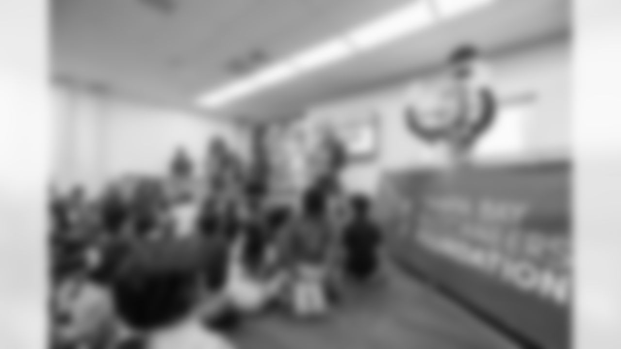 TAMPA, FL - March 03, 2026 - Safety Rashad Wisdom #38 of the Tampa Bay Buccaneers and Tampa Bay Buccaneers Cheerleaders during the National Reading Month celebration hosted by The Tampa Bay Buccaneers and Dr. Seuss Enterprises at Potter Elementary School. Photo By Doug DeFelice/Tampa Bay Buccaneers