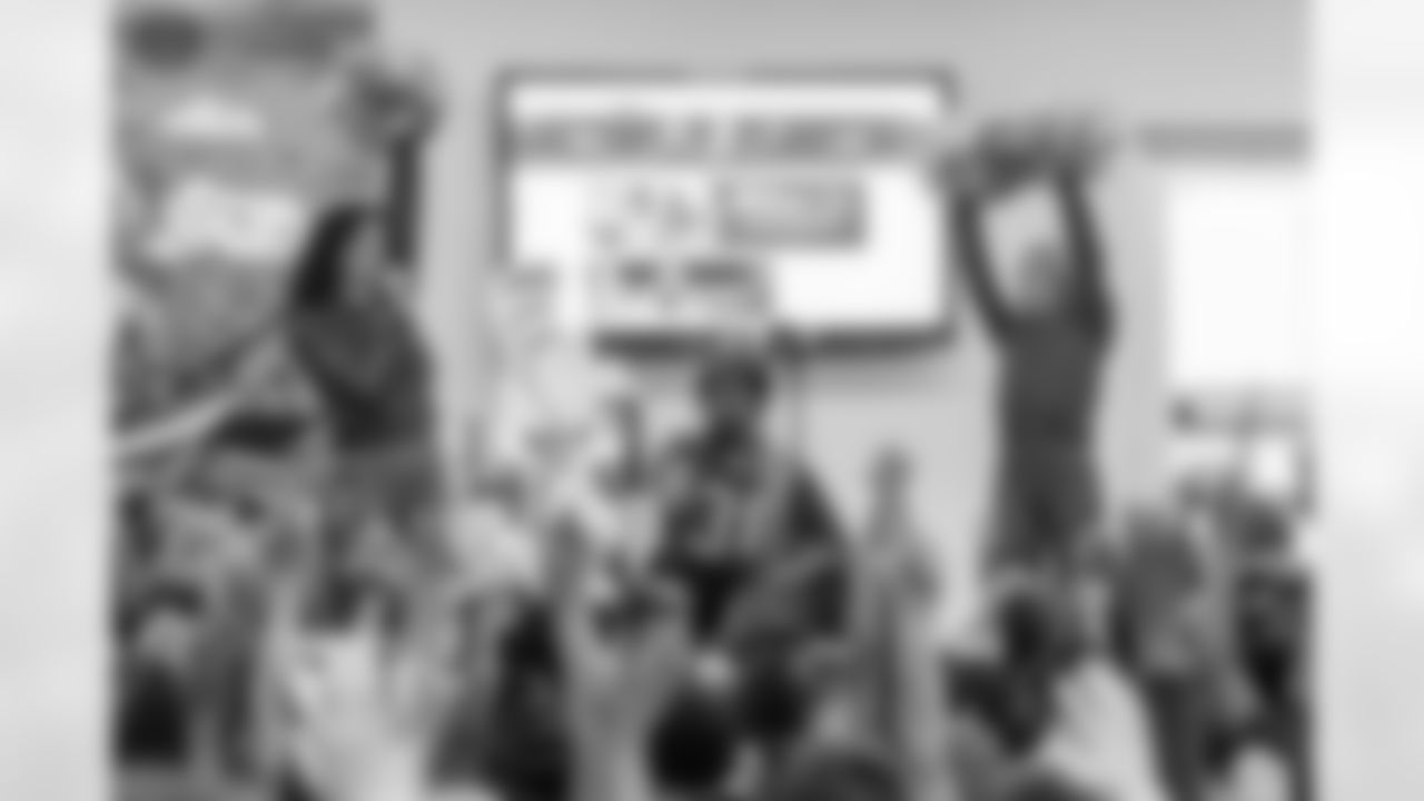 TAMPA, FL - March 03, 2026 - Safety Rashad Wisdom #38 of the Tampa Bay Buccaneers and Tampa Bay Buccaneers Cheerleaders during the National Reading Month celebration hosted by The Tampa Bay Buccaneers and Dr. Seuss Enterprises at Potter Elementary School. Photo By Doug DeFelice/Tampa Bay Buccaneers