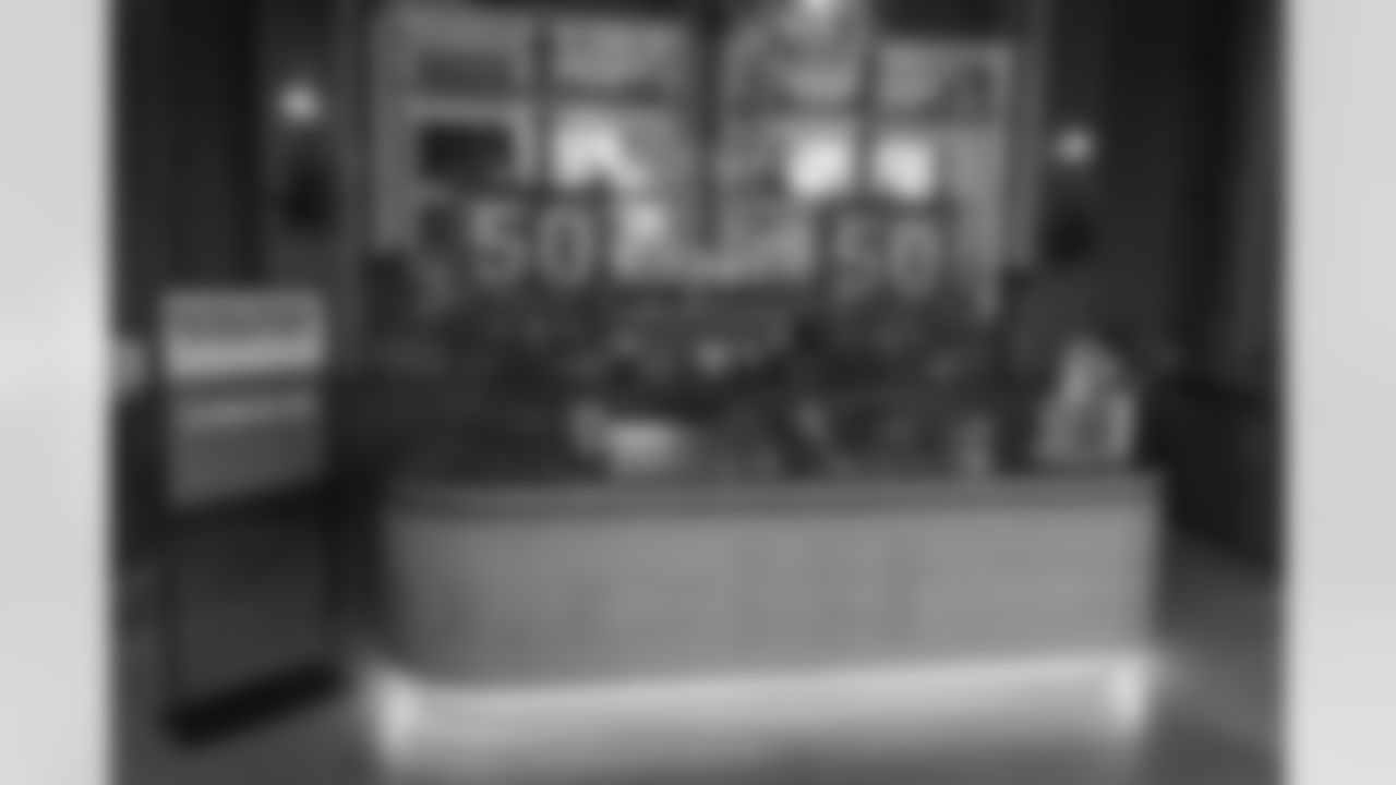 TAMPA, FL - December 06, 2025 - Set up for the She is Football Bayshore Walk: Raise The Flags event with Bayshore Breakfast Club and Tampa Girls Social & Wellness at Hyde House Public Studio. Photo By Mike Carlson/Tampa Bay Buccaneers