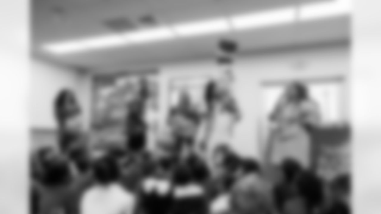 TAMPA, FL - March 03, 2026 - Safety Rashad Wisdom #38 of the Tampa Bay Buccaneers and Tampa Bay Buccaneers Cheerleaders during the National Reading Month celebration hosted by The Tampa Bay Buccaneers and Dr. Seuss Enterprises at Potter Elementary School. Photo By Doug DeFelice/Tampa Bay Buccaneers