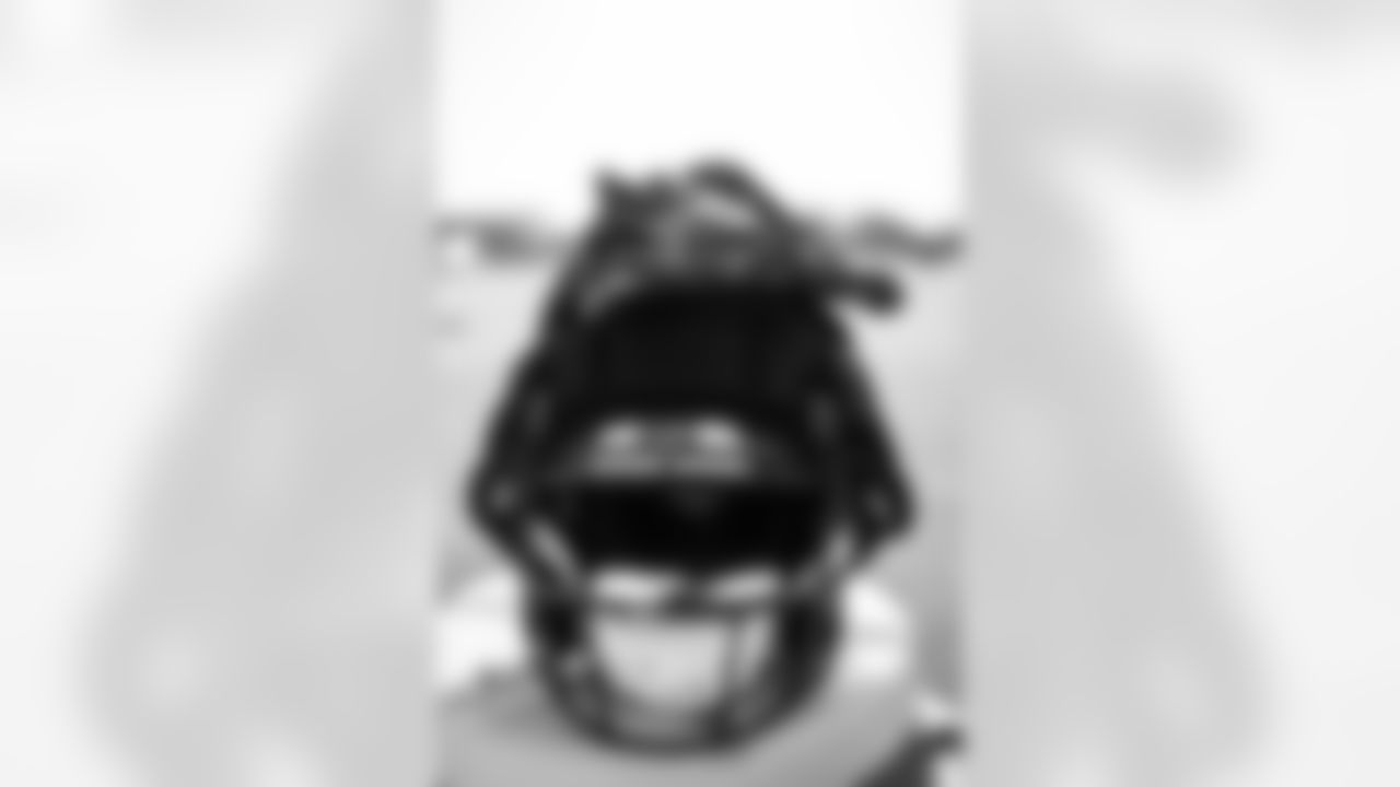 TAMPA, FL - July 25, 2025 - Wide Receiver Mike Evans #13 of the Tampa Bay Buccaneers' gloves and helmet during 2025 Training Camp at AdventHealth Training Center. Photo By Tori Richman/Tampa Bay Buccaneers