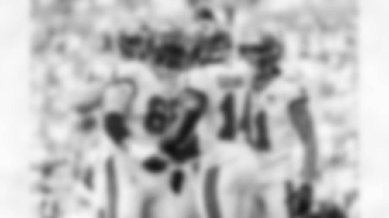 MIAMI GARDENS, FL - December 28, 2025 - Guard Feeney #65 and Wide Receiver Chris Godwin Jr. #14 of the Tampa Bay Buccaneers celebrate a touchdown during the game between the Tampa Bay Buccaneers and Miami Dolphins. The Bucs lost the game, 20-17. Photo By Kyle Zedaker/Tampa Bay Buccaneers