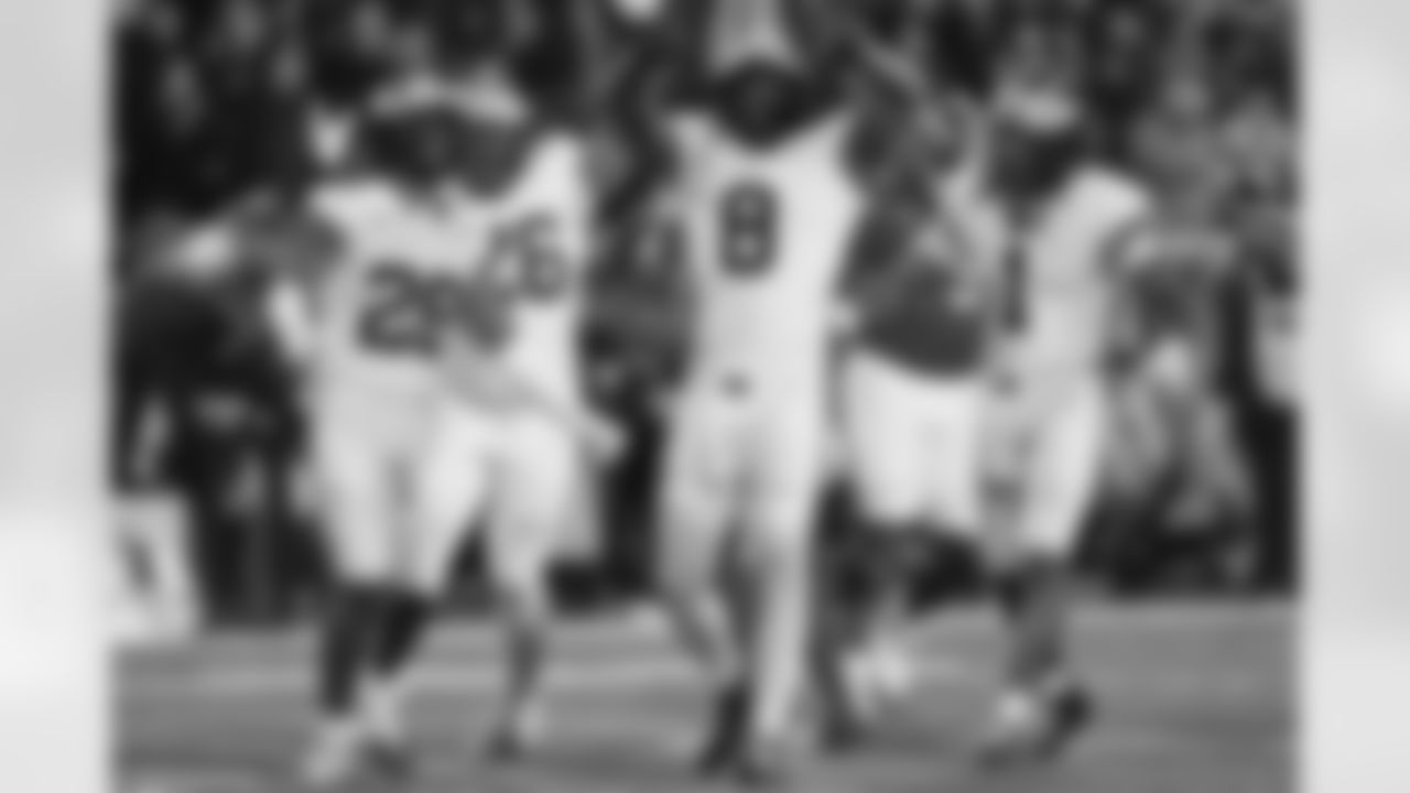 Michigan defensive end Derrick Moore (8) celebrates after a sack against Maryland quarterback Malik Washington to force a turnover during the second half of an NCAA college football game, Saturday, Nov. 22, 2025, in College Park, Md. (AP Photo/Stephanie Scarbrough)