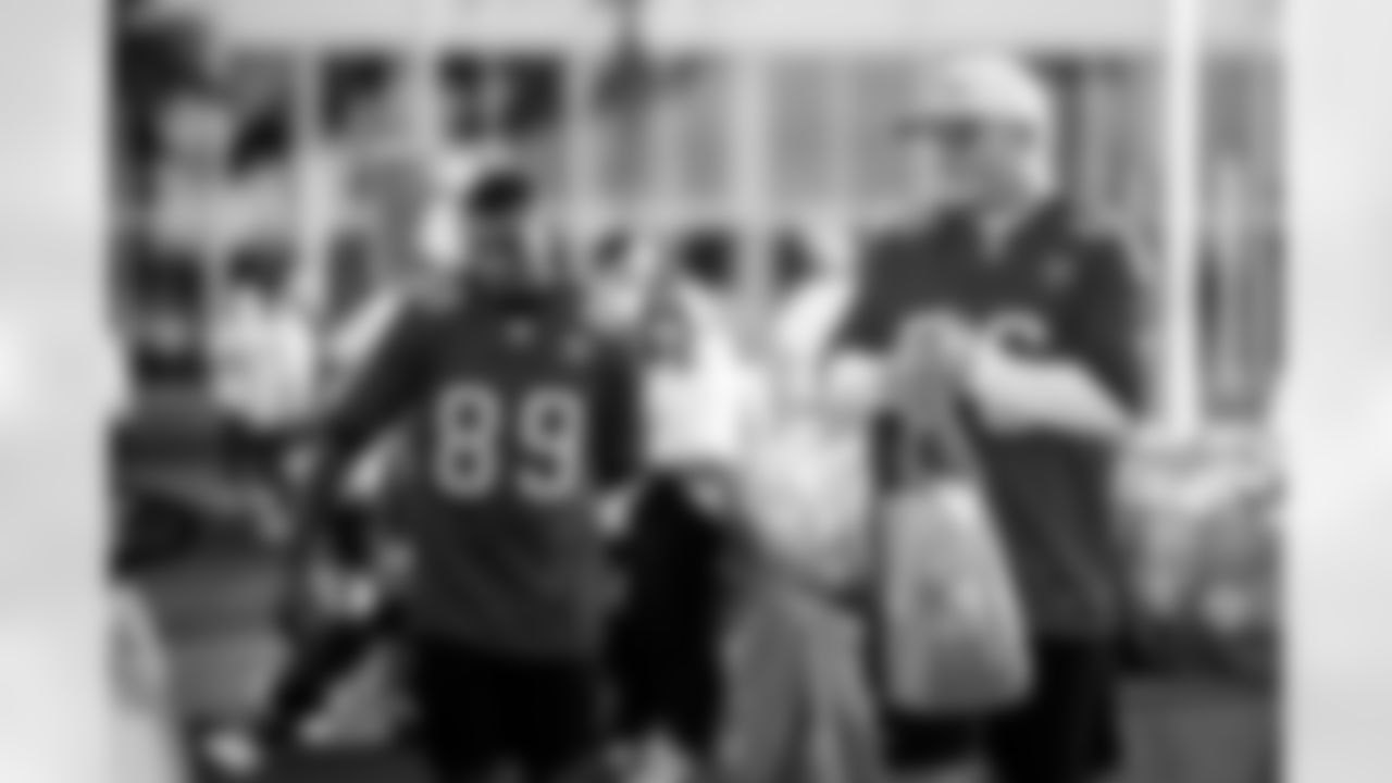 TAMPA, FL - November 25, 2025 - Wide Receiver Dennis Houston #89 and Tampa Bay Buccaneers Cheerleaders during Turkey Time with the O-Line. Photo By Kyle Zedaker/Tampa Bay Buccaneers