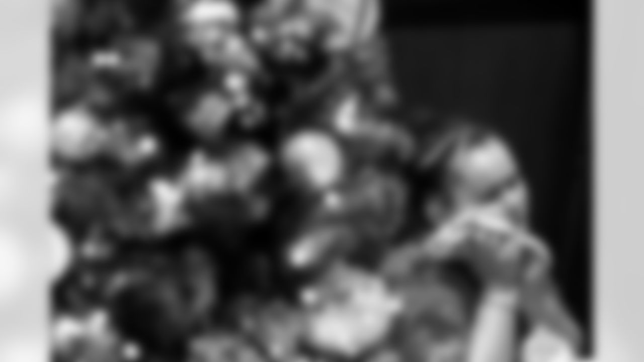 TAMPA, FL - December 05, 2025 - Mike and Ashli Evans host the Mike Evans Family Foundation 'Catch for Christmas' holiday event at AdventHealth Training Center. Photo By Kyle Zedaker/Tampa Bay Buccaneers