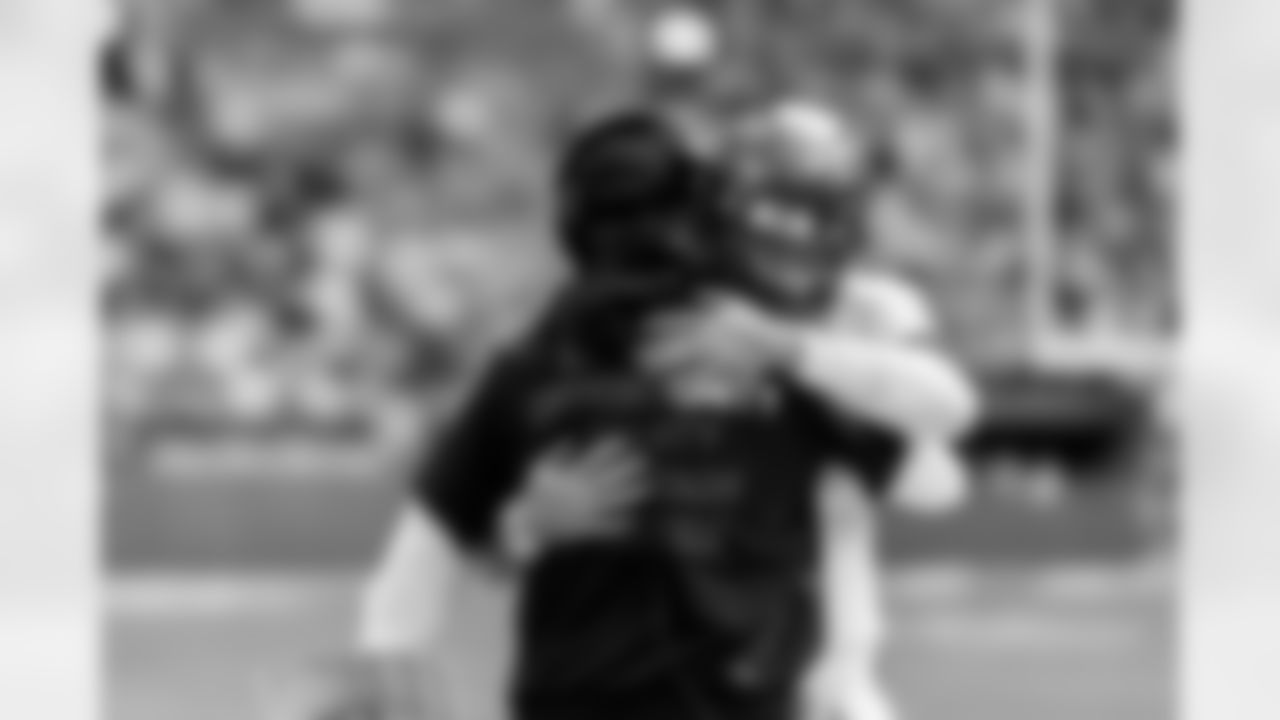 MIAMI GARDENS, FL - December 28, 2025 - Offensive Coordinator Josh Grizzard and Quarterback Baker Mayfield #6 of the Tampa Bay Buccaneers before the game between the Tampa Bay Buccaneers and Miami Dolphins. The Bucs lost the game, 20-17. Photo By Tori Richman/Tampa Bay Buccaneers