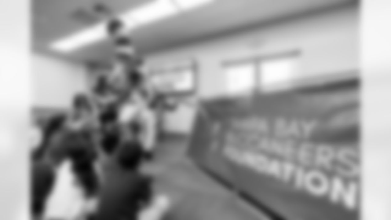 TAMPA, FL - March 03, 2026 - Safety Rashad Wisdom #38 of the Tampa Bay Buccaneers and Tampa Bay Buccaneers Cheerleaders during the National Reading Month celebration hosted by The Tampa Bay Buccaneers and Dr. Seuss Enterprises at Potter Elementary School. Photo By Doug DeFelice/Tampa Bay Buccaneers