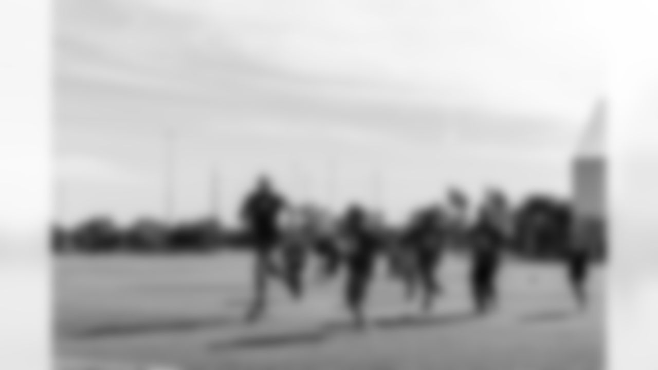 TAMPA, FL - December 05, 2025 - Mike and Ashli Evans host the Mike Evans Family Foundation 'Catch for Christmas' holiday event at AdventHealth Training Center. Photo By Kyle Zedaker/Tampa Bay Buccaneers