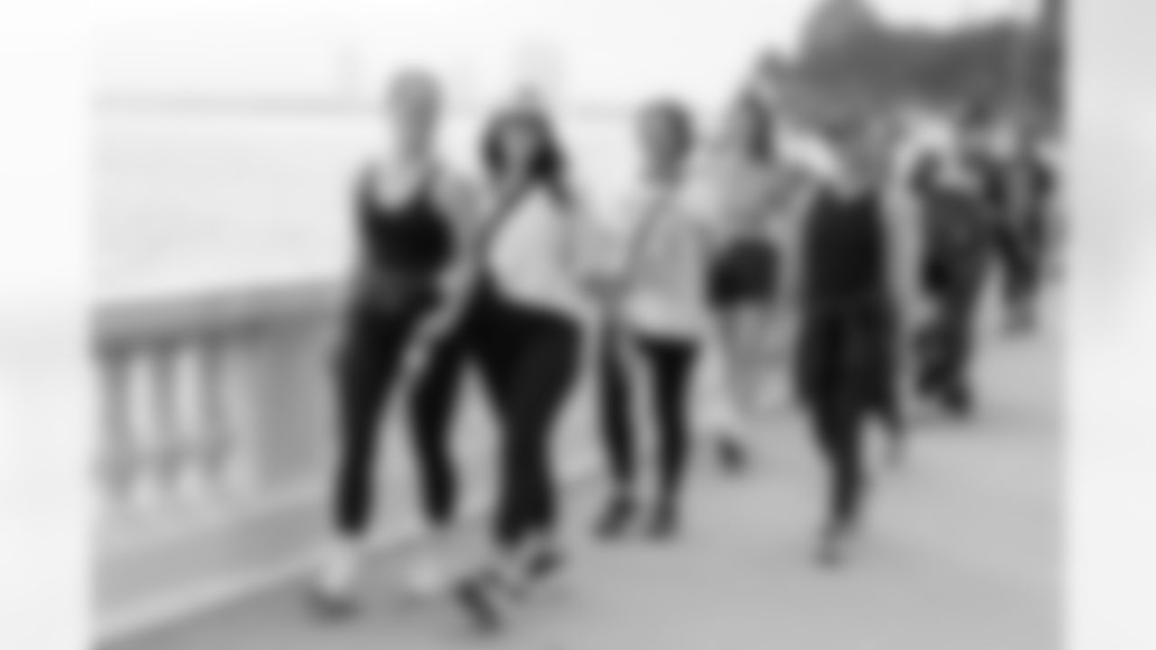 TAMPA, FL - December 06, 2025 - She is Football Bayshore Walk: Raise The Flags event with Bayshore Breakfast Club and Tampa Girls Social & Wellness at Hyde House Public Studio. Photo By Mike Carlson/Tampa Bay Buccaneers