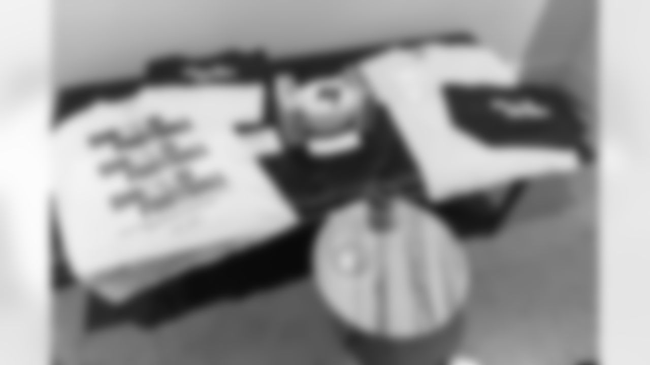 TAMPA, FL - December 06, 2025 - Set up for the She is Football Bayshore Walk: Raise The Flags event with Bayshore Breakfast Club and Tampa Girls Social & Wellness at Hyde House Public Studio. Photo By Mike Carlson/Tampa Bay Buccaneers