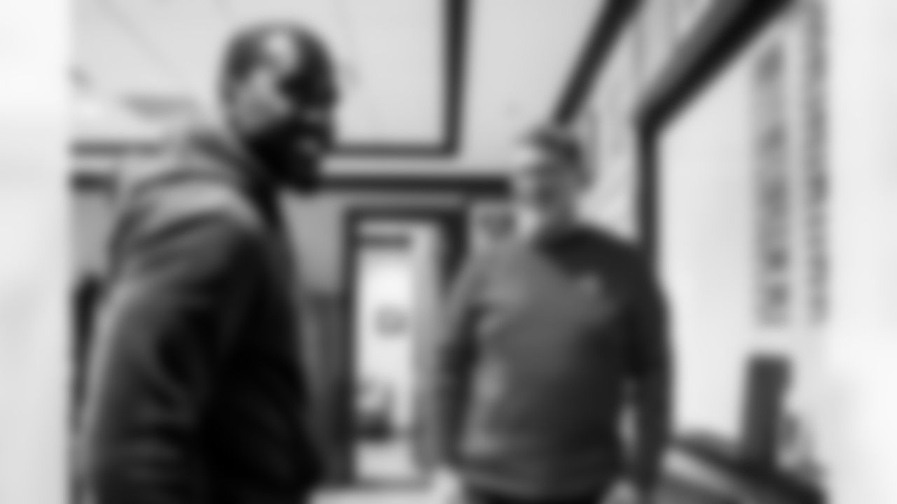 TAMPA, FL - March 22, 2024 - Inside Linebacker Lavonte David #54 of the Tampa Bay Buccaneers and General Manager Jason Licht as he arrives to sign his contract at AdventHealth Training Center. Photo By Tori Richman/Tampa Bay Buccaneers