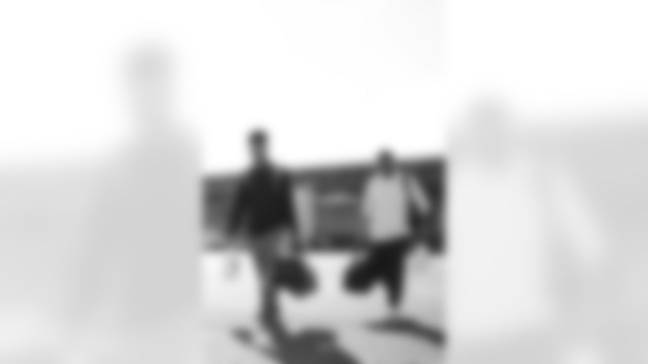 TAMPA, FL - November 22, 2025 - Wide Receiver Emeka Egbuka #2 and Defensive Quality Control Coach Joey Fitzgerald of the Tampa Bay Buccaneers depart before the game against the Los Angeles Rams. Photo By Tori Richman/Tampa Bay Buccaneers