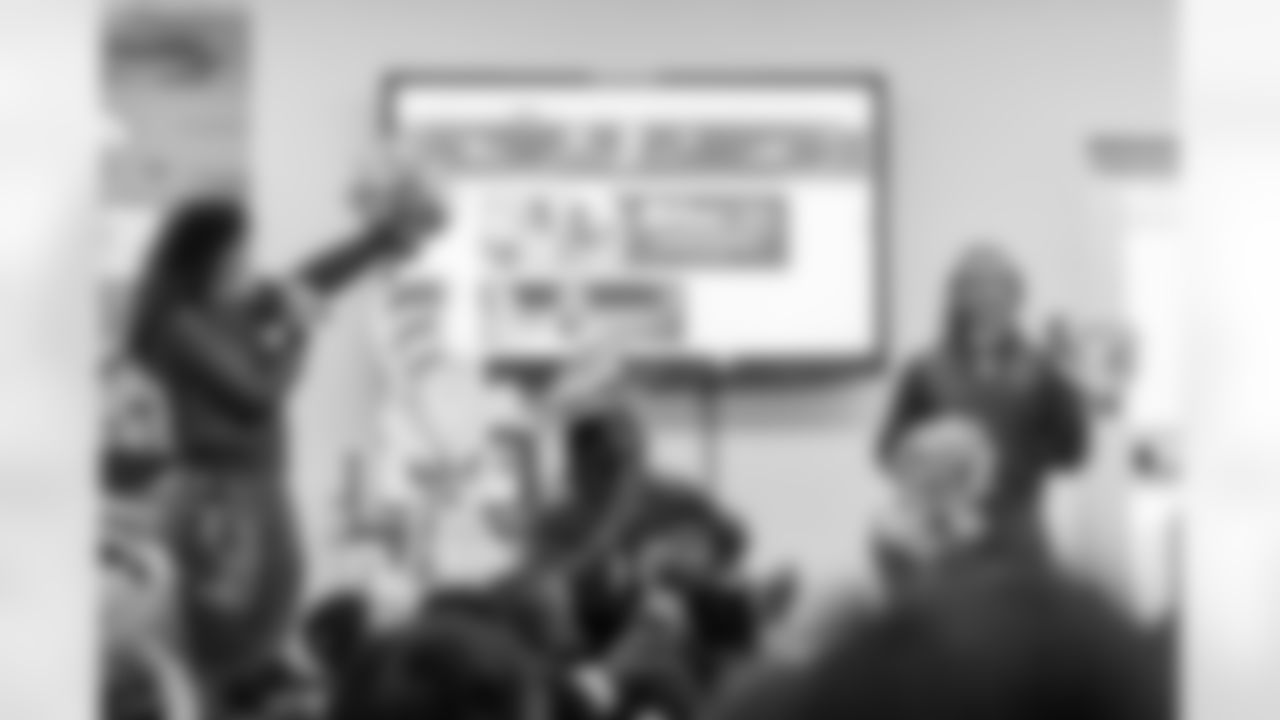 TAMPA, FL - March 03, 2026 - Safety Rashad Wisdom #38 of the Tampa Bay Buccaneers and Tampa Bay Buccaneers Cheerleaders during the National Reading Month celebration hosted by The Tampa Bay Buccaneers and Dr. Seuss Enterprises at Potter Elementary School. Photo By Doug DeFelice/Tampa Bay Buccaneers