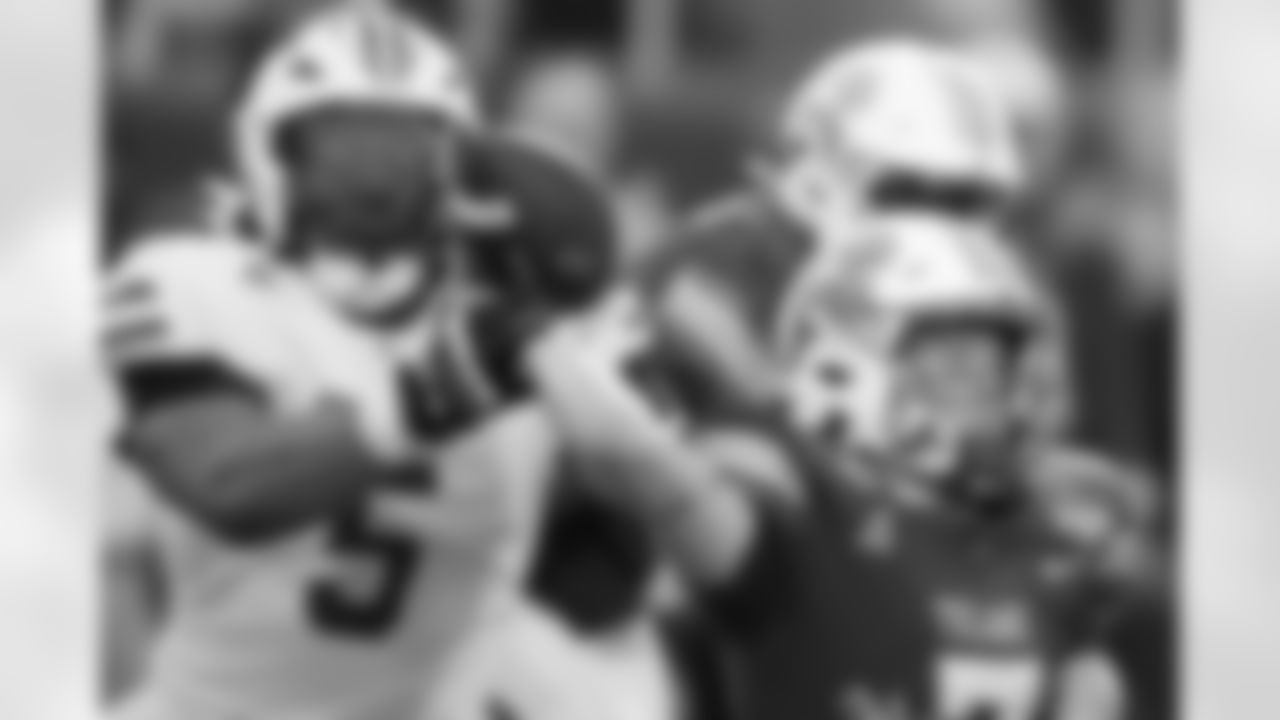 SMU defensive end Elijah Roberts (5) grabs the arm of Tulane quarterback Michael Pratt (7) during the first half of the American Athletic Conference championship NCAA college football game, Saturday, Dec. 2, 2023, in New Orleans. (AP Photo/Gerald Herbert)