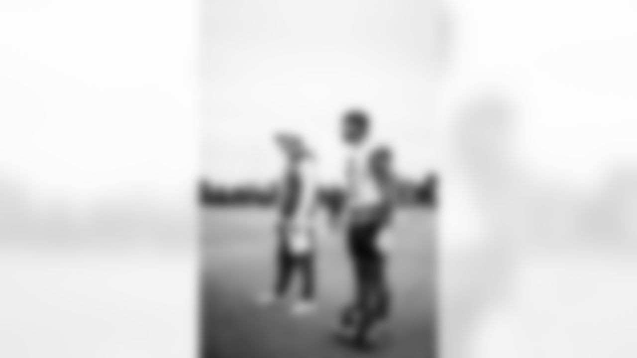 TAMPA, FL - November 06, 2025 - Offensive Coordinator Josh Grizzard and Wide Receiver Emeka Egbuka #2 of the Tampa Bay Buccaneers during practice at AdventHealth Training Center. Photo By Tori Richman/Tampa Bay Buccaneers