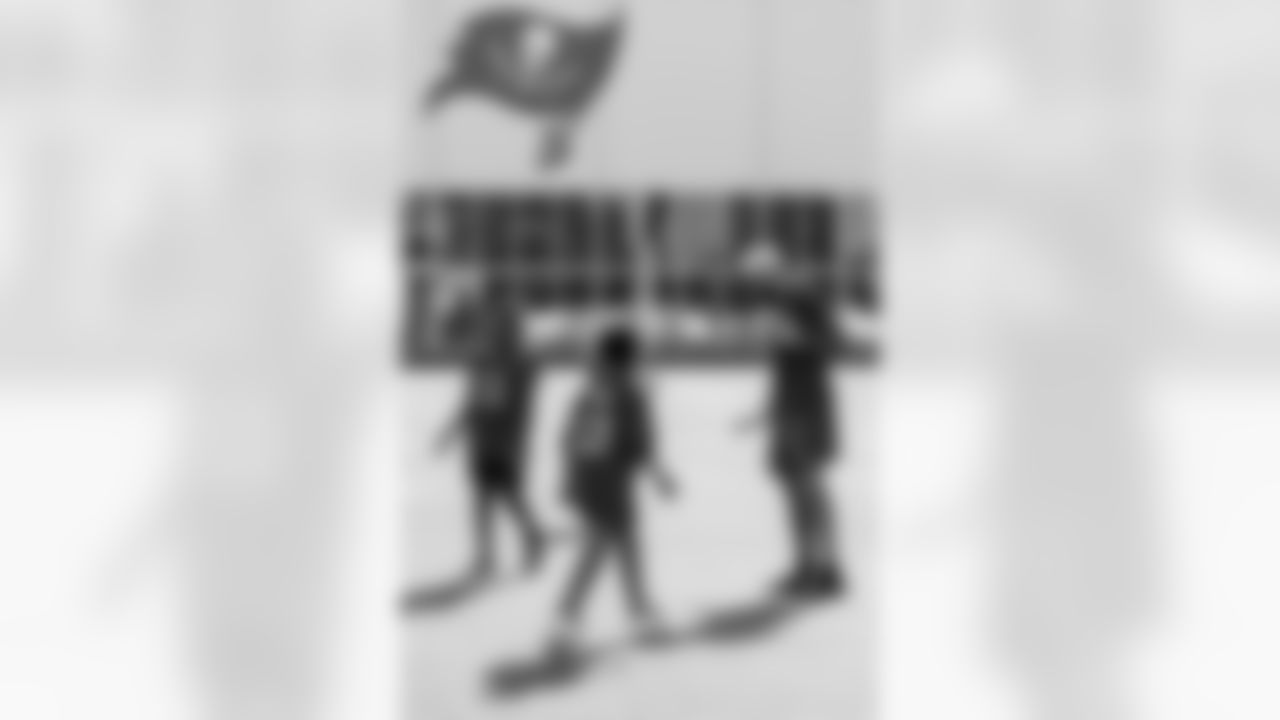 TAMPA, FL - December 05, 2025 - Mike and Ashli Evans host the Mike Evans Family Foundation 'Catch for Christmas' holiday event at AdventHealth Training Center. Photo By Kyle Zedaker/Tampa Bay Buccaneers