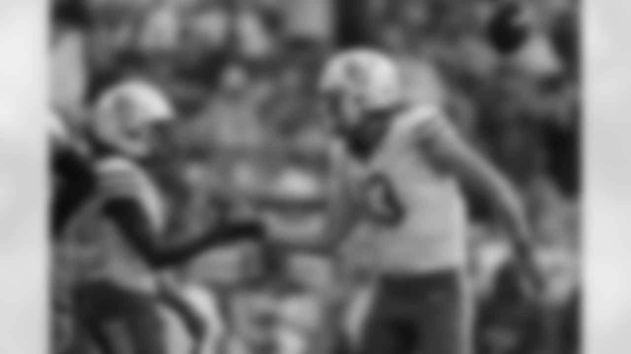 Baylor running back Bryson Washington, left, is congratulated by quarterback Sawyer Robertson (13) after a rushing touchdown during the first half of an NCAA college football game against TCU, Saturday, Oct. 18, 2025, in Fort Worth, Texas. (AP Photo/LM Otero)