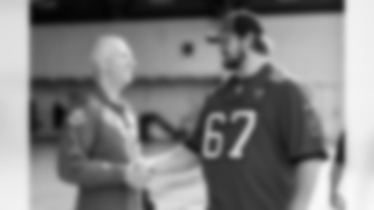 TAMPA, FL - December 02, 2025 - Colonel Edward V. Szczepanik and Guard Luke Goedeke #67 of the Tampa Bay Buccaneers during a visit to MacDill Air Force Base. Photo By Kyle Zedaker/Tampa Bay Buccaneers