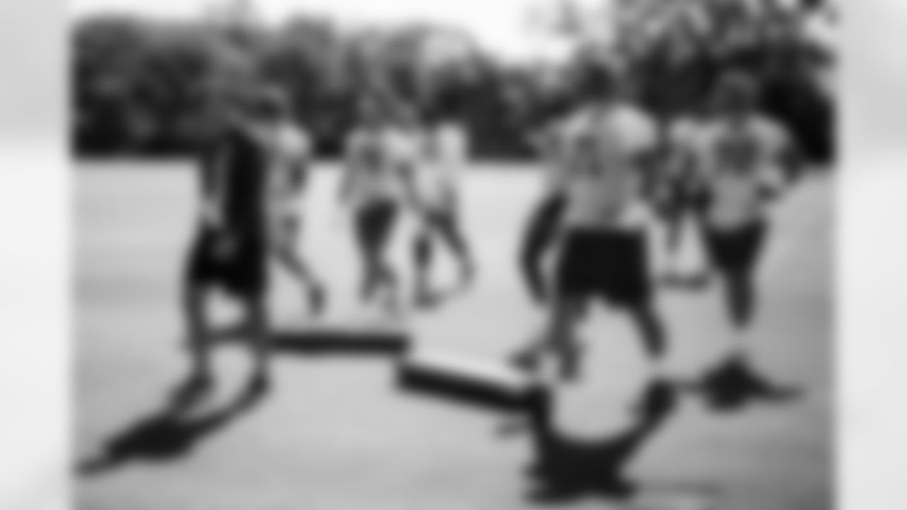 TAMPA, FL - June 11, 2025 - Run Game Coordinator/Offensive Line Coach Kevin Carberry, Tackle Garret Greenfield #74, Tackle Tristan Wirfs #78, Offensive Tackle Ben Chukwuma #70, Offensive Lineman Lorenz Metz #71, and Tackle Luke Haggard #72 of the Tampa Bay Buccaneers during 2025 Minicamp at AdventHealth Training Center. Photo By Kyle Zedaker/Tampa Bay Buccaneers