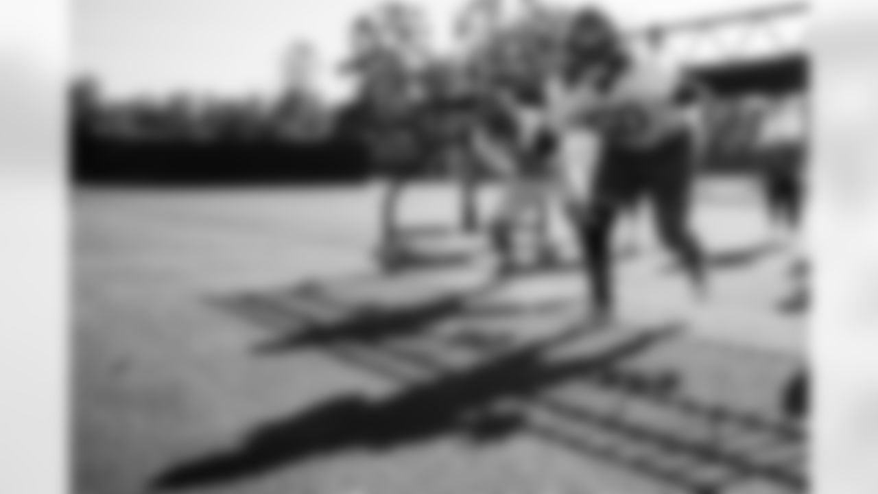 TAMPA, FL - December 24, 2025 - Center Graham Barton #62 and Guard Mike Jordan #60 of the Tampa Bay Buccaneers during practice at AdventHealth Training Center. Photo By Kyle Zedaker/Tampa Bay Buccaneers