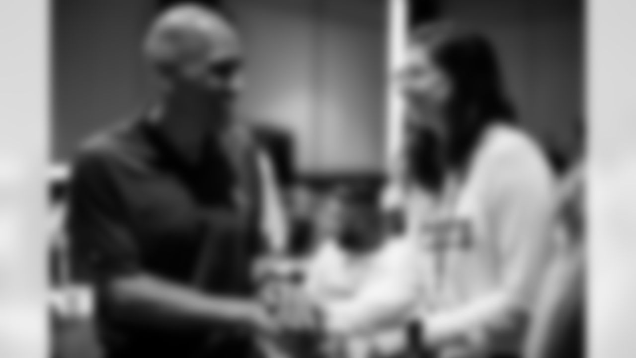 TAMPA, FL - May 07, 2024 - Buccaneers Legend Tony Dungy and Ester Alencar, Quarterbacks Coach Rio Preto Weilers, during a session of the National Coaching Academy at AdventHealth Training Center. Photo By Kyle Zedaker/Tampa Bay Buccaneers
