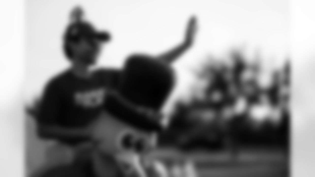 TAMPA, FL - November 25, 2025 - Volunteers during Turkey Time with the O-Line. Photo By Kyle Zedaker/Tampa Bay Buccaneers