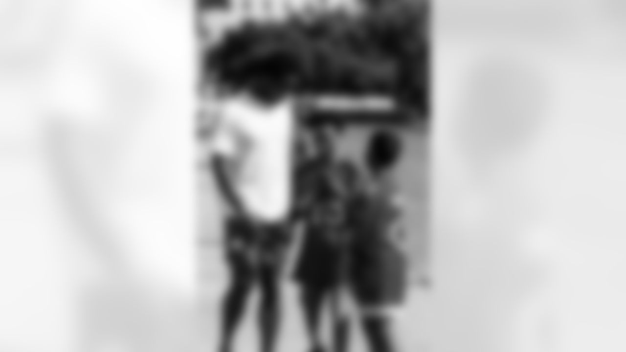 TAMPA, FL - December 05, 2025 - Mike and Ashli Evans host the Mike Evans Family Foundation 'Catch for Christmas' holiday event at AdventHealth Training Center. Photo By Kyle Zedaker/Tampa Bay Buccaneers