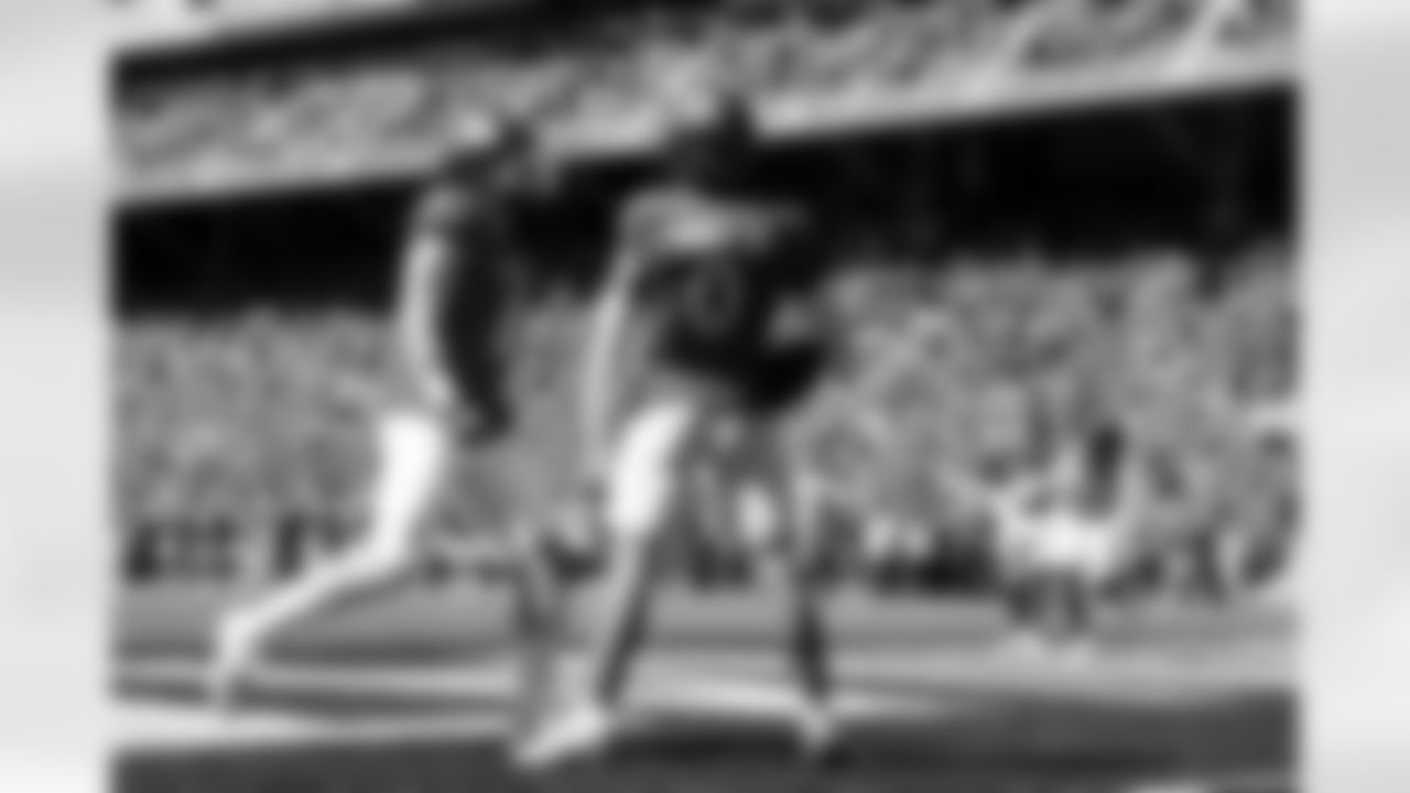 Cincinnati defensive back Josh Minkins (0) celebrates with teammate Jake Golday after making an interception during the first half of an NCAA college football game against Pittsburgh, Saturday, Sept. 7, 2024, in Cincinnati. (AP Photo/Jeff Dean)
